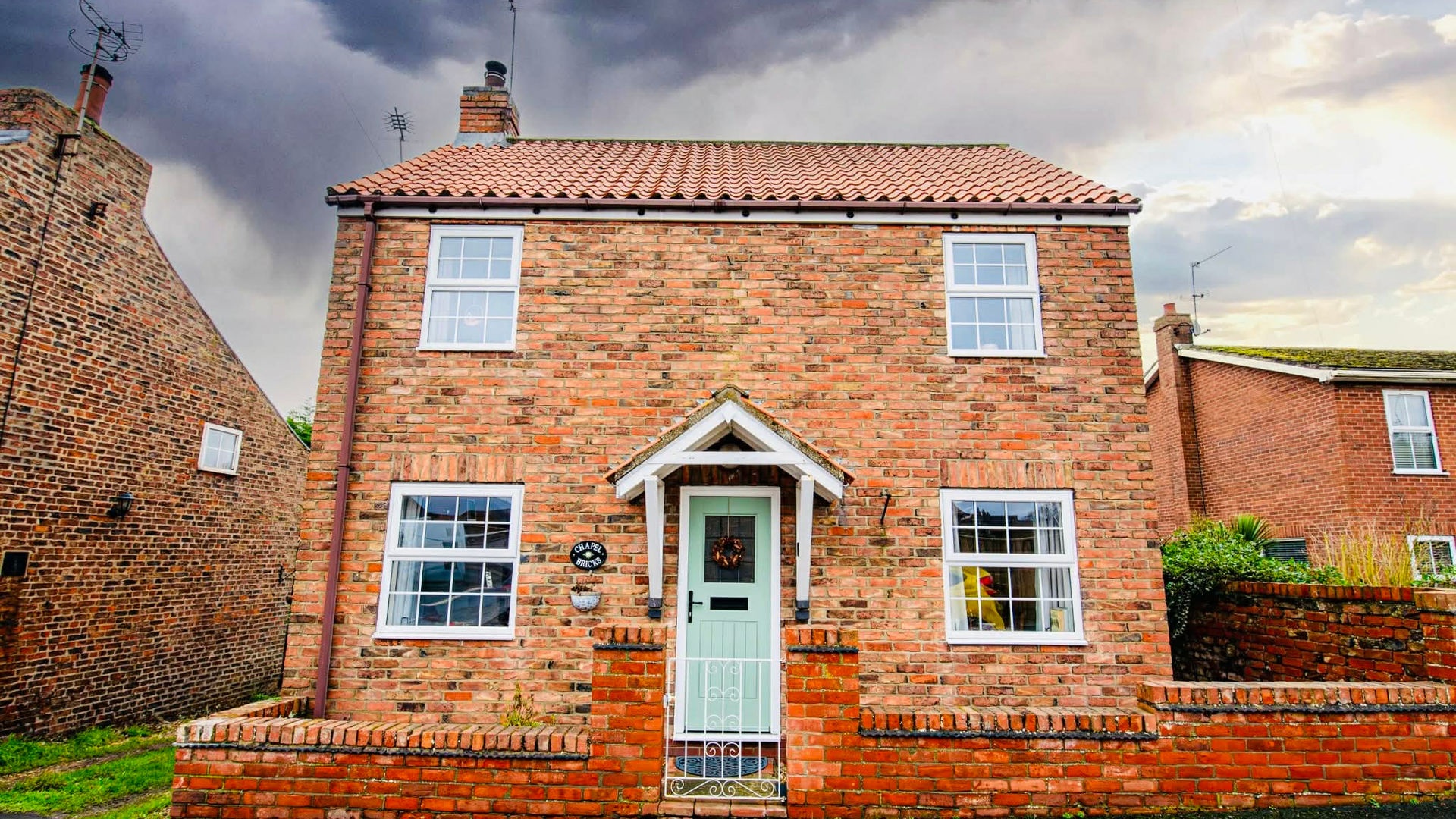 Exterior of Chapel Bricks Cottage, constructed with historic chapel bricks